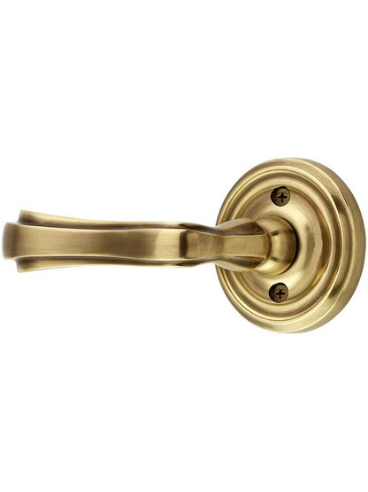 Classic Rosette Door Set with Wembley Levers Left Handed in Antique Brass.
